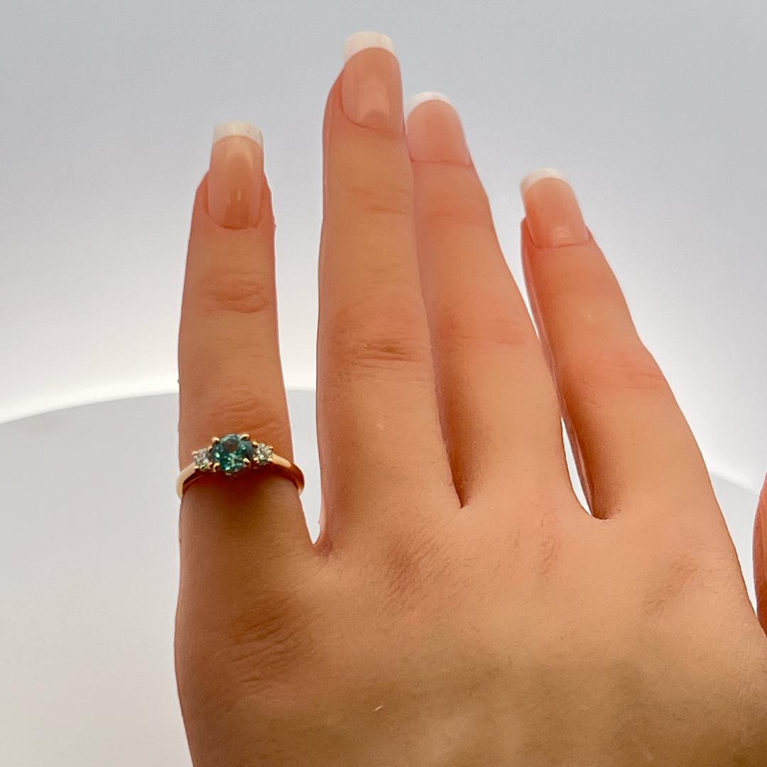 0.50 Carat Blue Zicron 0.20 Carat Round Diamond 14K YG Three-Stone Ring