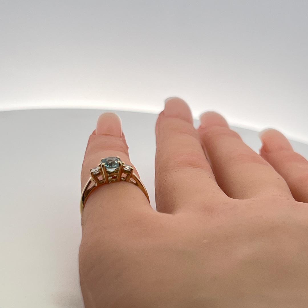 0.50 Carat Blue Zicron 0.20 Carat Round Diamond 14K YG Three-Stone Ring