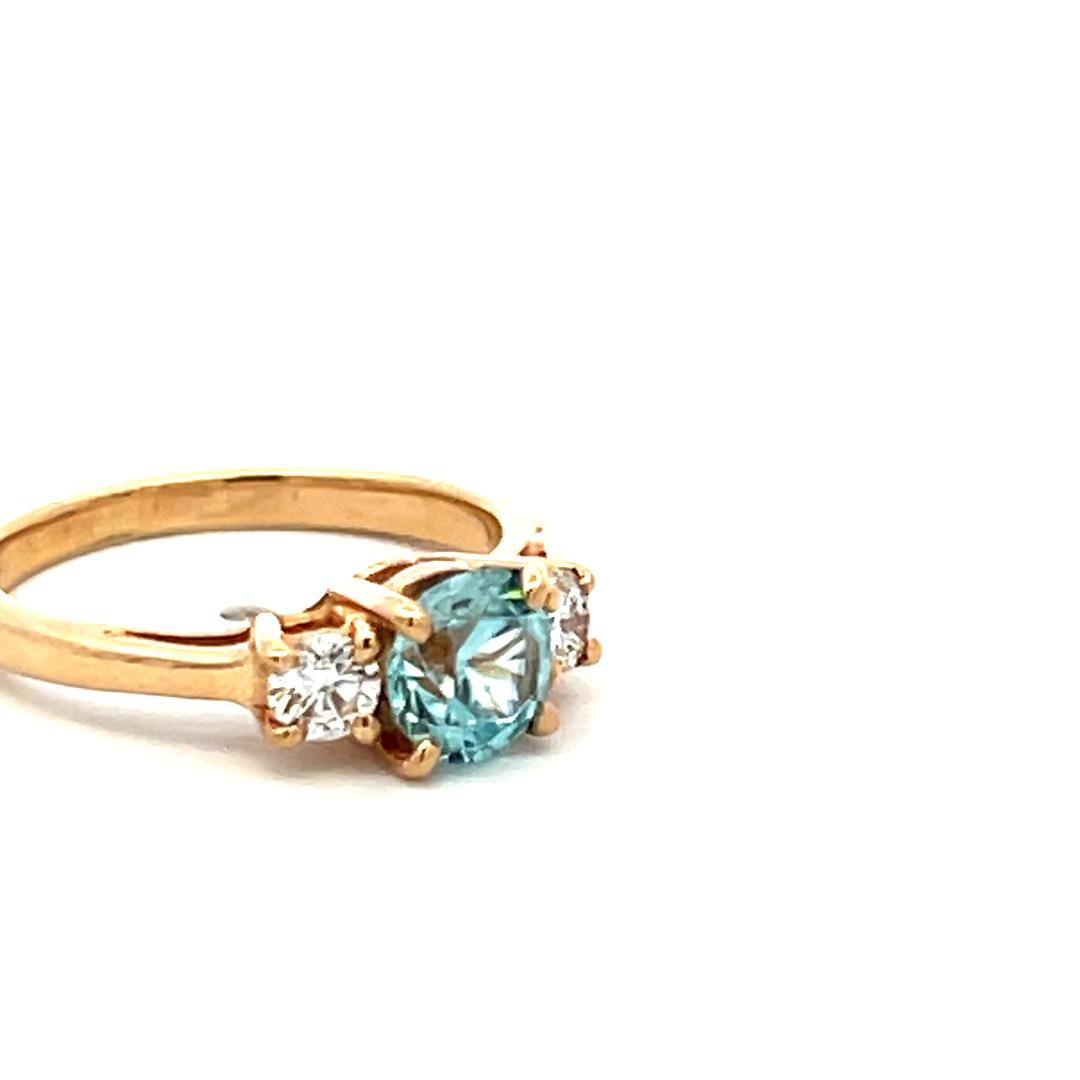 0.50 Carat Blue Zicron 0.20 Carat Round Diamond 14K YG Three-Stone Ring