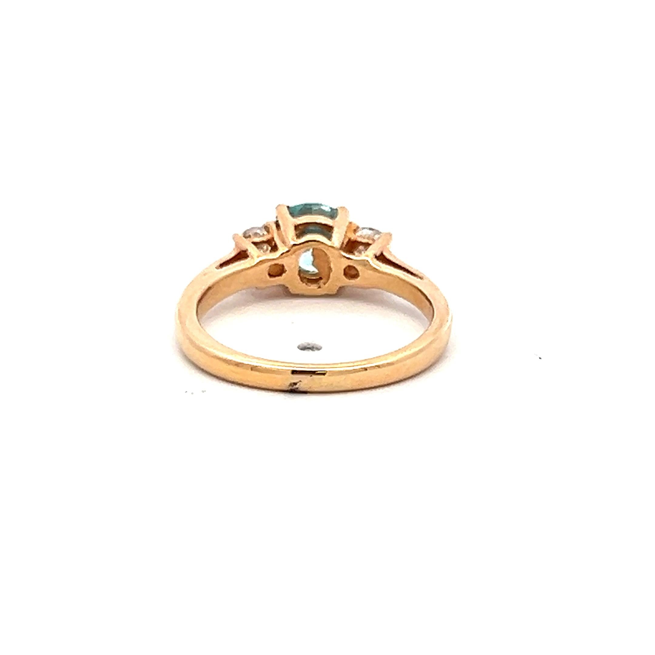 0.50 Carat Blue Zicron 0.20 Carat Round Diamond 14K YG Three-Stone Ring
