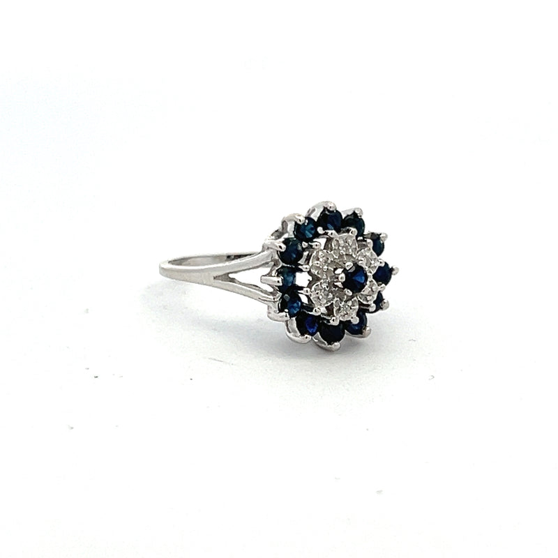 0.70 Carat Sapphire 0.06 Carat Round Brilliant Diamond Platinum Cluster Ring