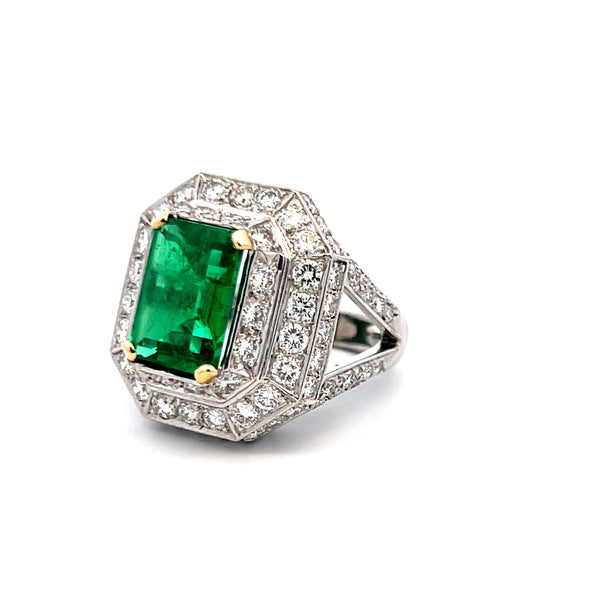 4.31 Carat Emerald 3.48 Carat Round Diamond Platinum 18K Gold Halo Ring