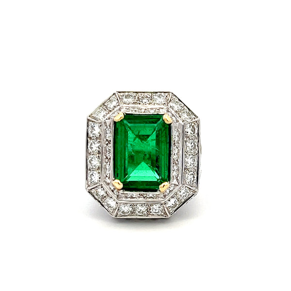 4.31 Carat Emerald 3.48 Carat Round Diamond Platinum 18K Gold Halo Ring