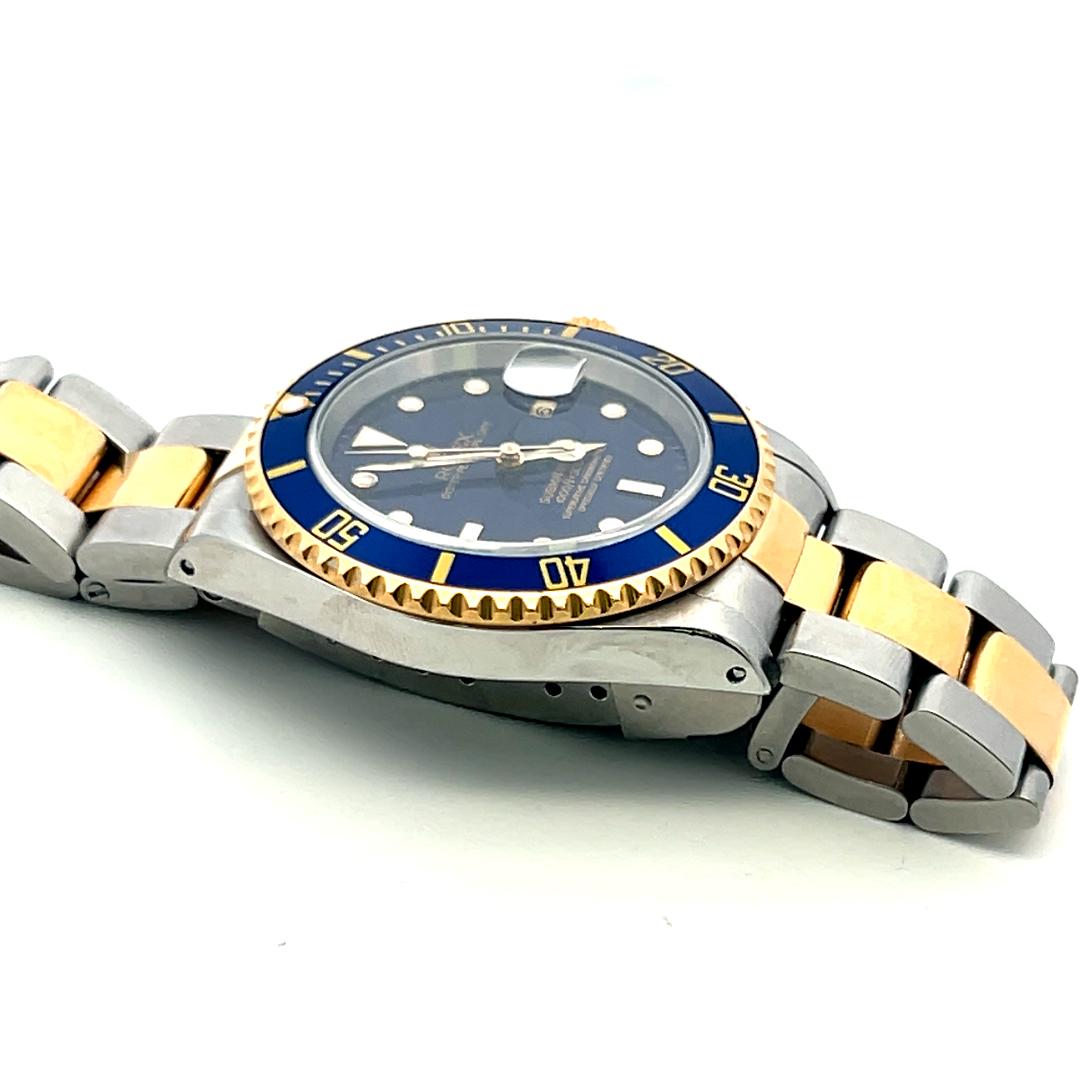 Rolex Submariner 18K Gold Steel Blue Dial Reference 16613 Box and Paper