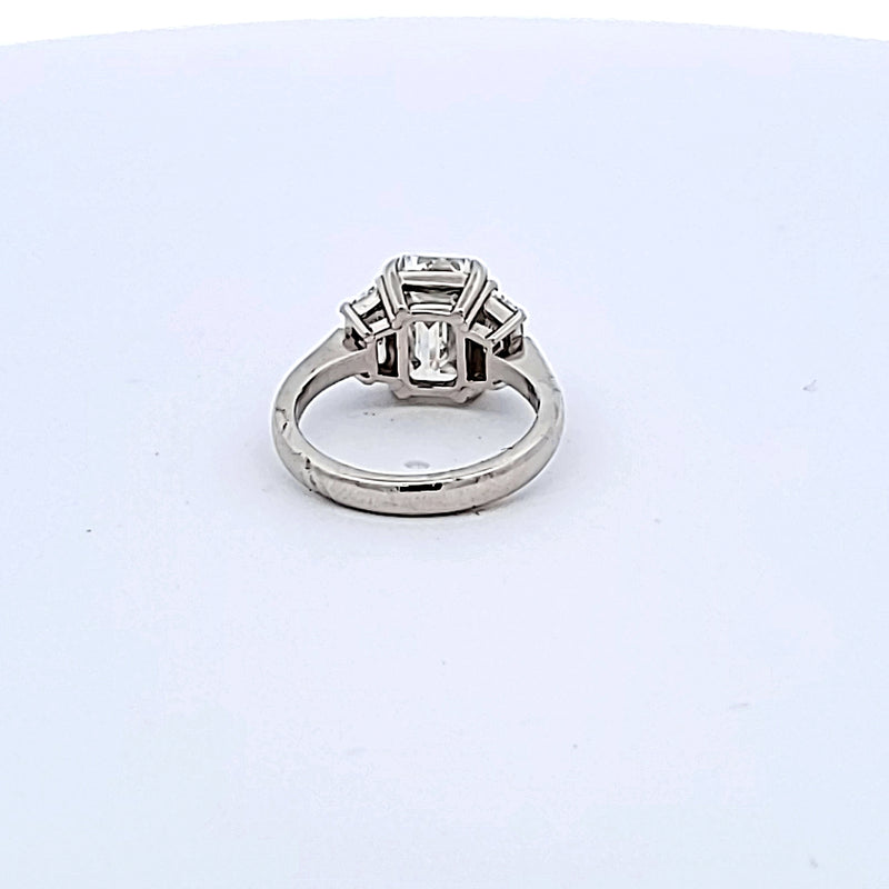 4.04 Carat Emerald Cut and Trapezoid Shape Diamond Platinum Three-Stone Ring