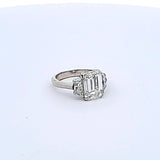 4.04 Carat Emerald Cut and Trapezoid Shape Diamond Platinum Three-Stone Ring