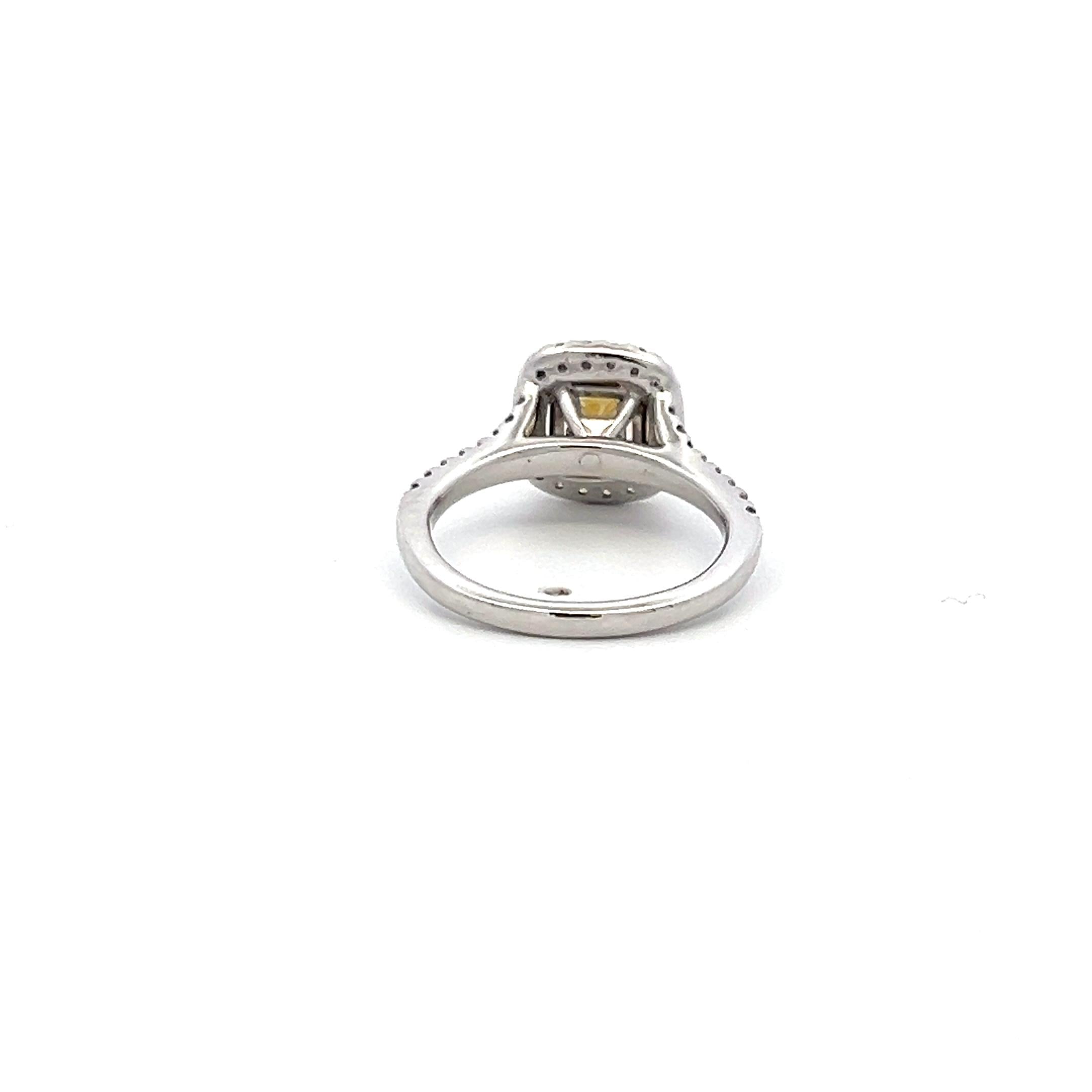 1.92 Carat Radiant Fancy light yellow and Round Diamond 14K WG Engagement Ring