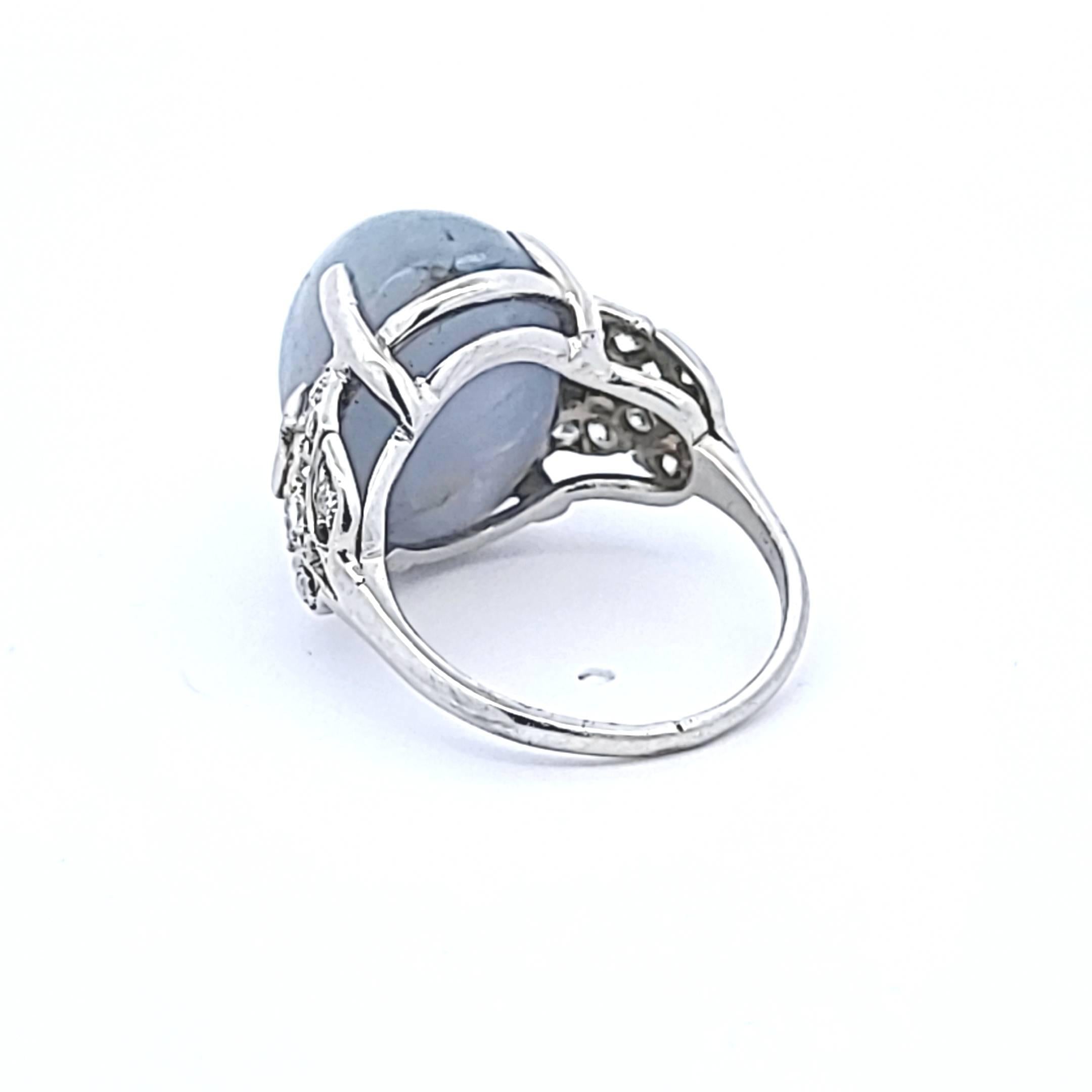 Platinum Gemstone Ring with 0.5 Ct Diamonds and 20 Ct Star Sapphire