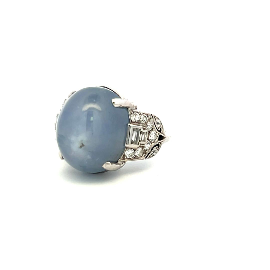 Platinum Gemstone Ring with 0.5 Ct Diamonds and 20 Ct Star Sapphire