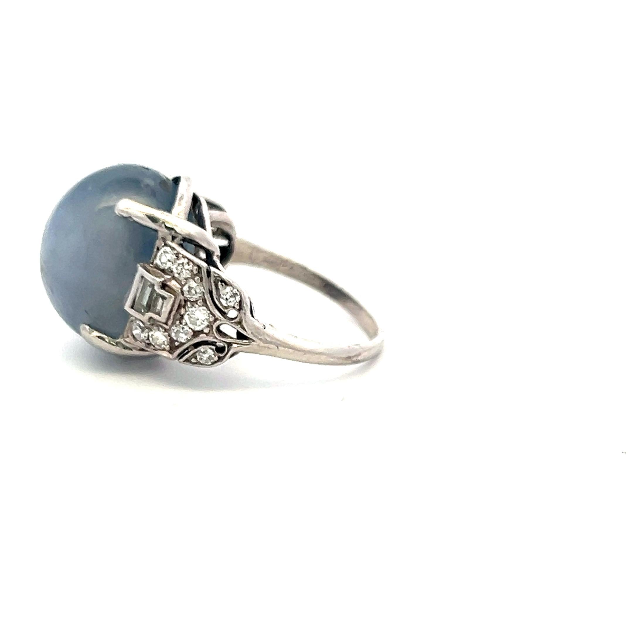 Platinum Gemstone Ring with 0.5 Ct Diamonds and 20 Ct Star Sapphire