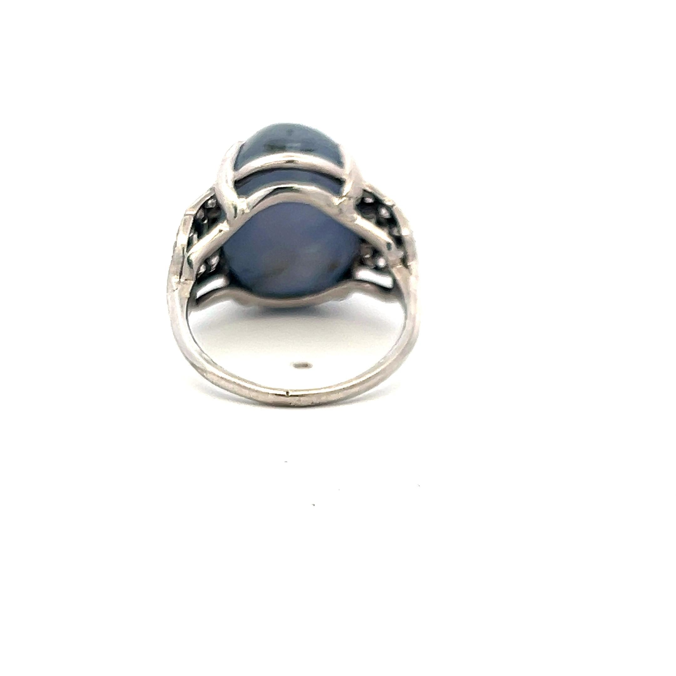 Platinum Gemstone Ring with 0.5 Ct Diamonds and 20 Ct Star Sapphire