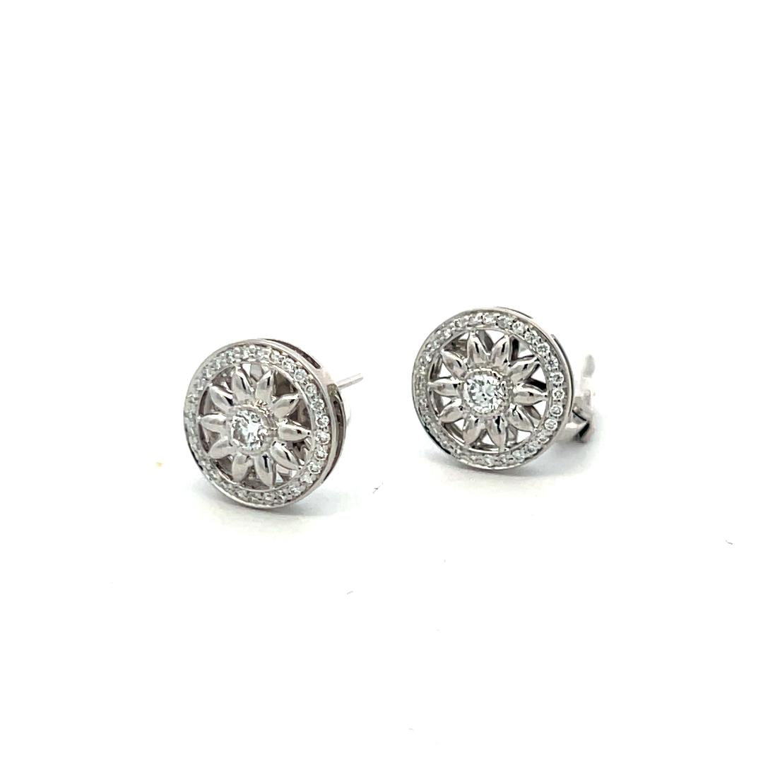 Harry Winston Platinum Clip On Earrings with 0.55 Carat Round F-VS1 Diamonds