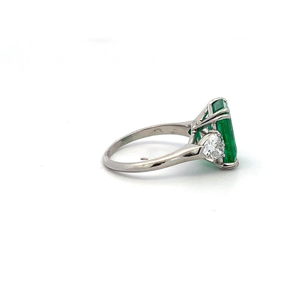 3.36 Carat Emerald 0.60 Carat Triangular Shape Diamond Platinum Engagement Ring