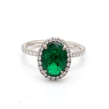 2.19 Carat Emerald 0.60 Carat Round Diamond 18 Karat White Gold Halo Ring