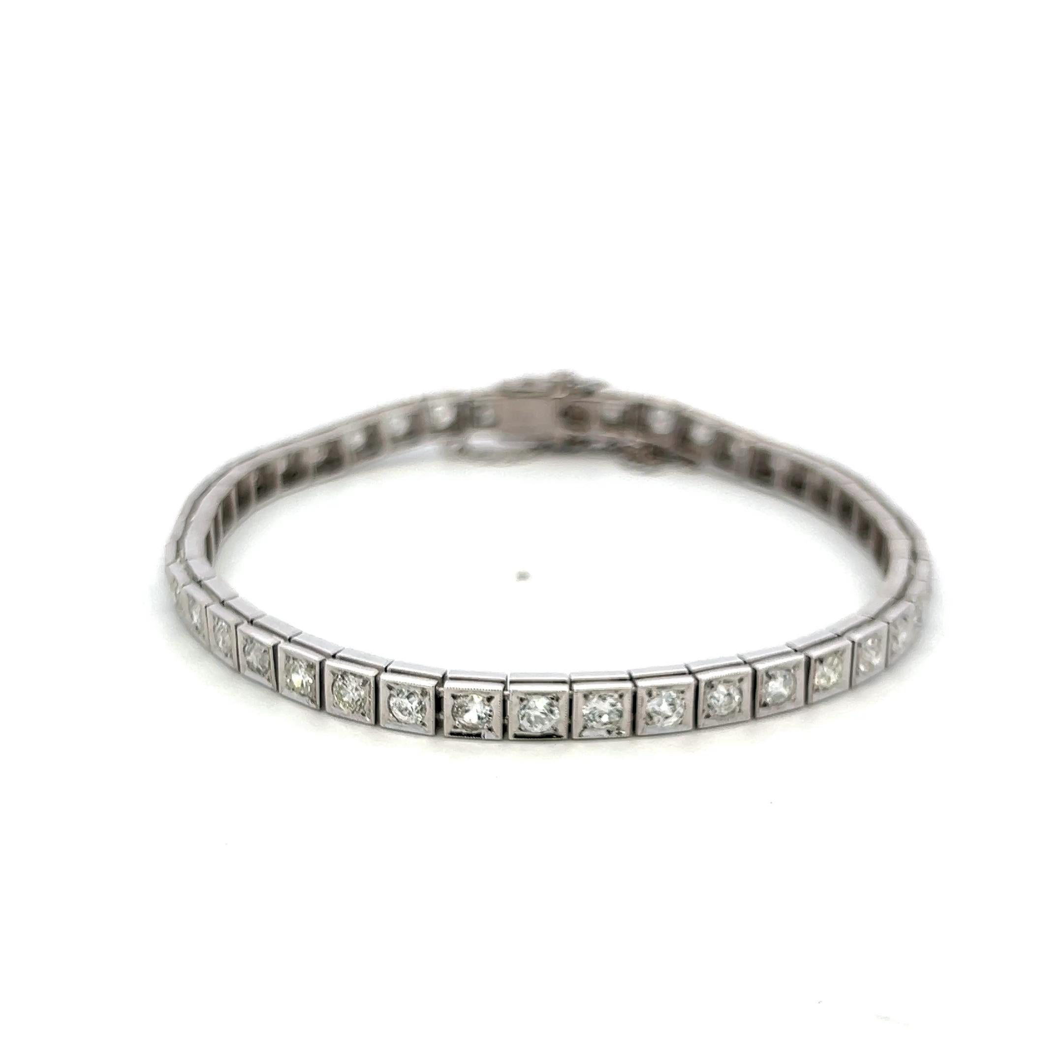 Vintage Platinum Tennis Bracelet with 4.49ct Baguette & Old European Cut Diamond