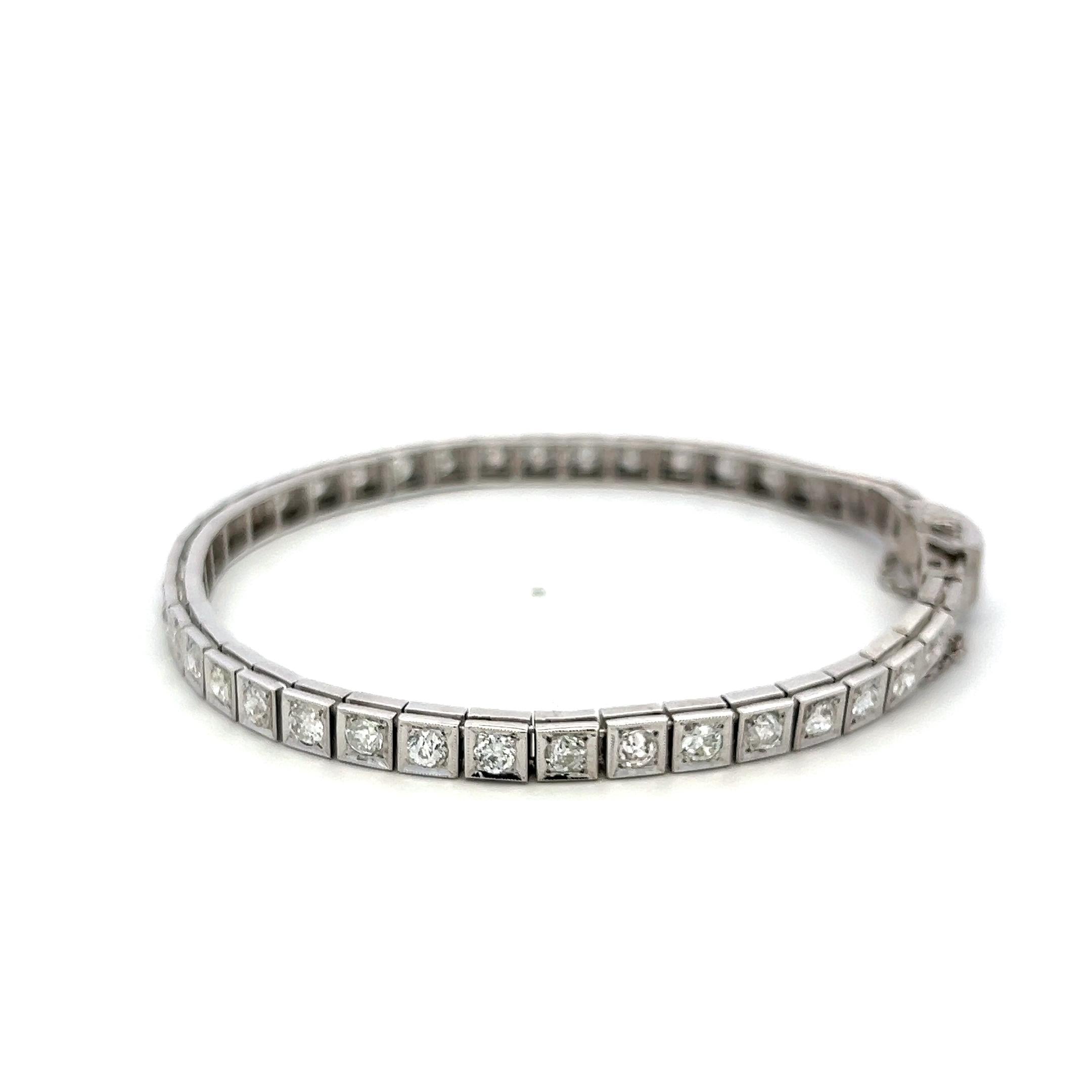 Vintage Platinum Tennis Bracelet with 4.49ct Baguette & Old European Cut Diamond