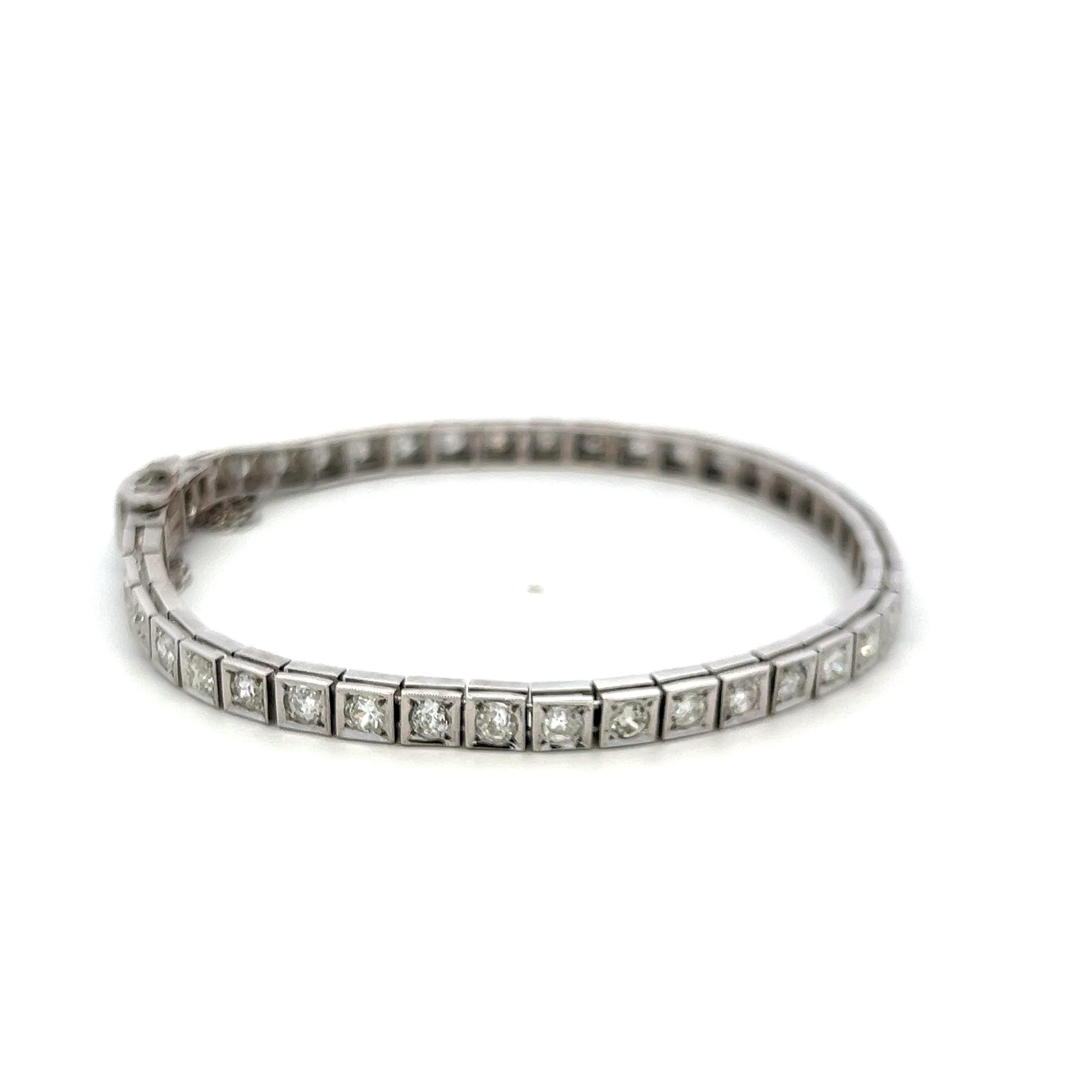 Vintage Platinum Tennis Bracelet with 4.49ct Baguette & Old European Cut Diamond