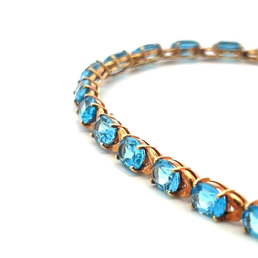 Vintage 21.00ct Oval Shape Blue Topaz Tennis Bracelet in 18K Yellow Gold