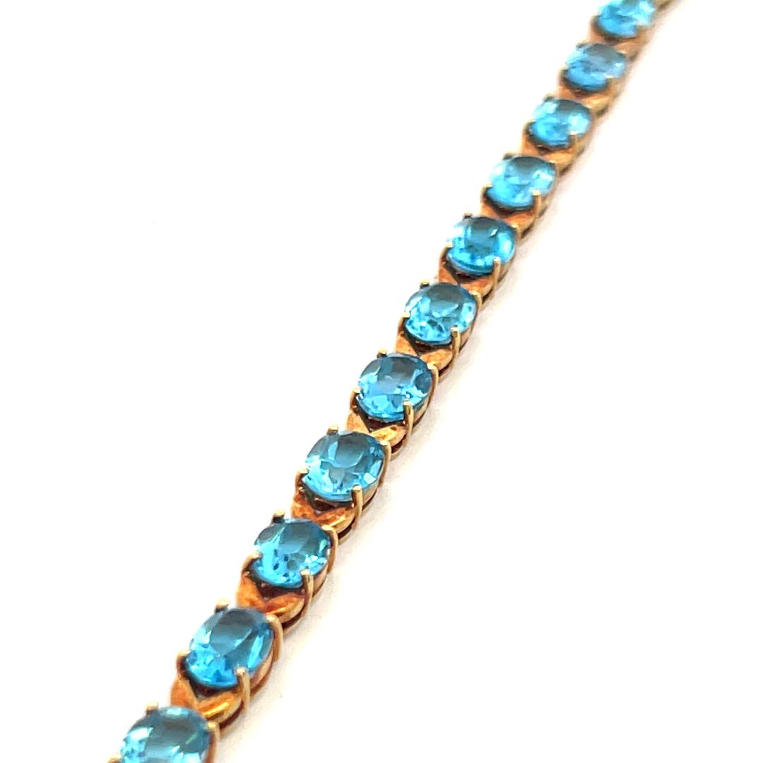 Vintage 21.00ct Oval Shape Blue Topaz Tennis Bracelet in 18K Yellow Gold