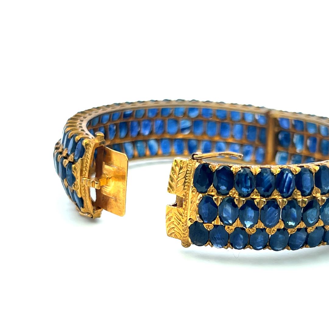 18K Yellow Gold Bangle Bracelet with 75 Carat Oval Sapphire Gemstones