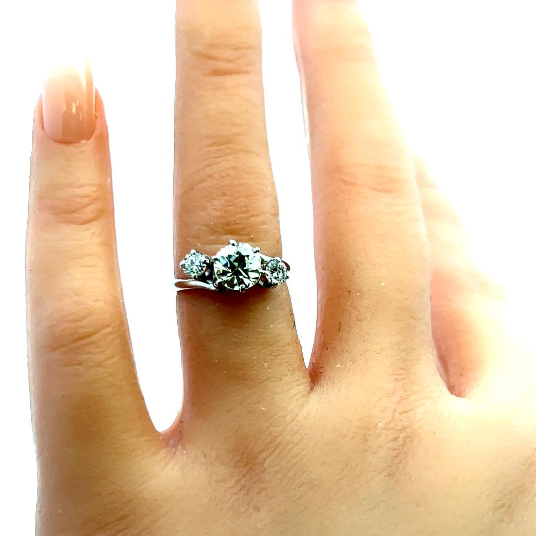 Vintage Three-Stone Platinum Ring with 1.30 Carat Old European cut GIA Diamond
