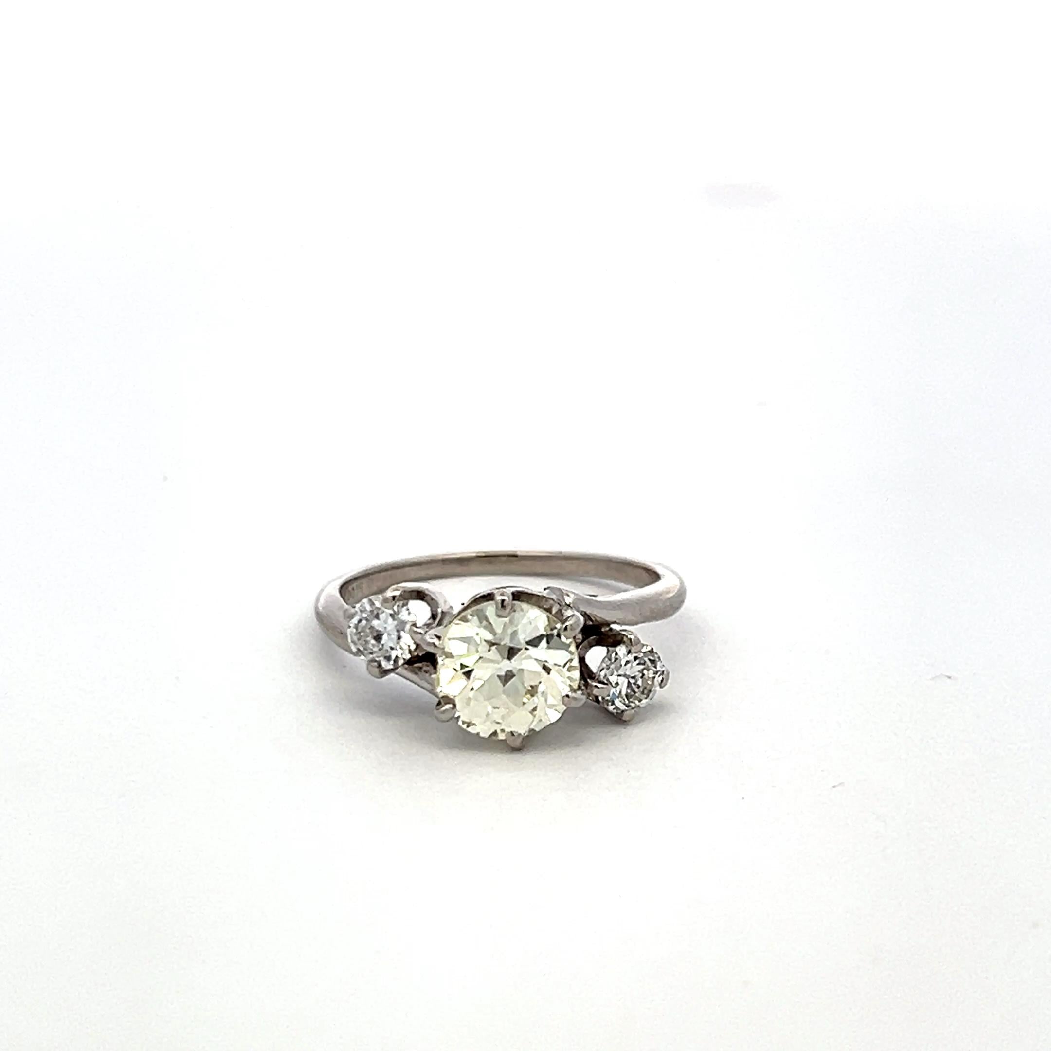 Vintage Three-Stone Platinum Ring with 1.30 Carat Old European cut GIA Diamond