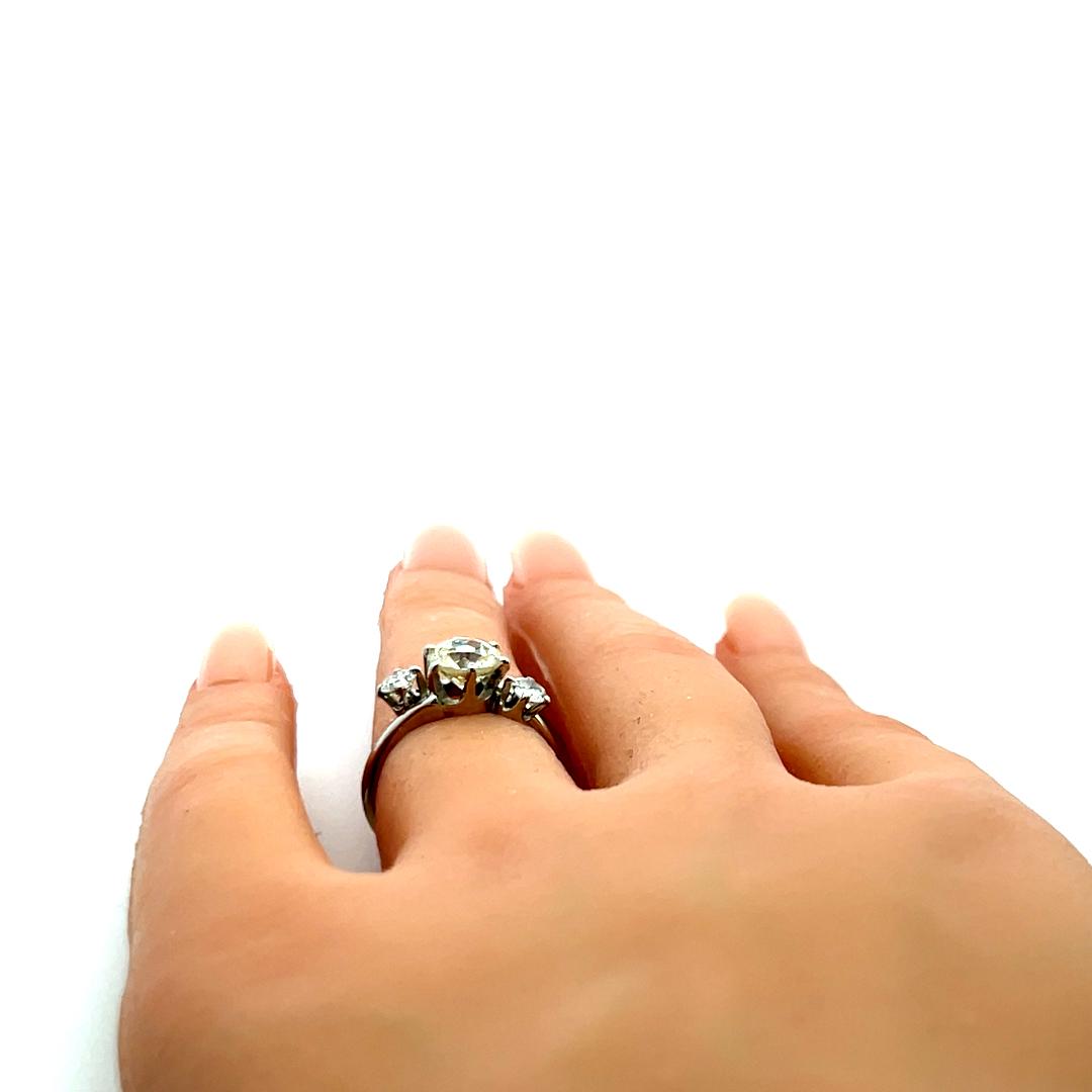 Vintage Three-Stone Platinum Ring with 1.30 Carat Old European cut GIA Diamond