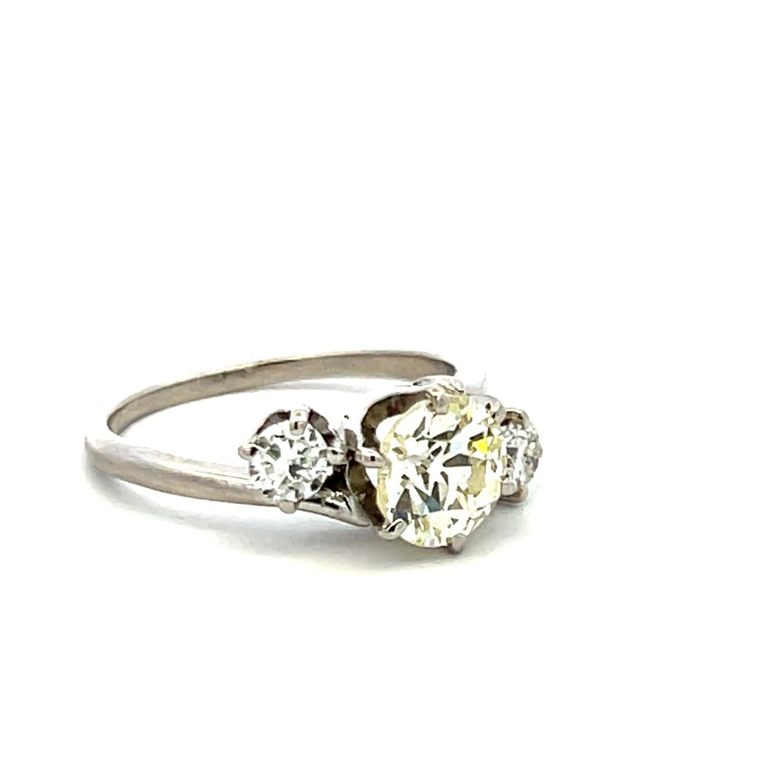Vintage Three-Stone Platinum Ring with 1.30 Carat Old European cut GIA Diamond