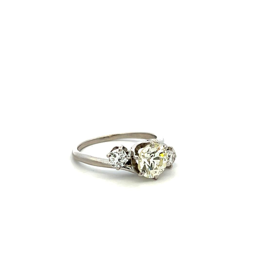 Vintage Three-Stone Platinum Ring with 1.30 Carat Old European cut GIA Diamond