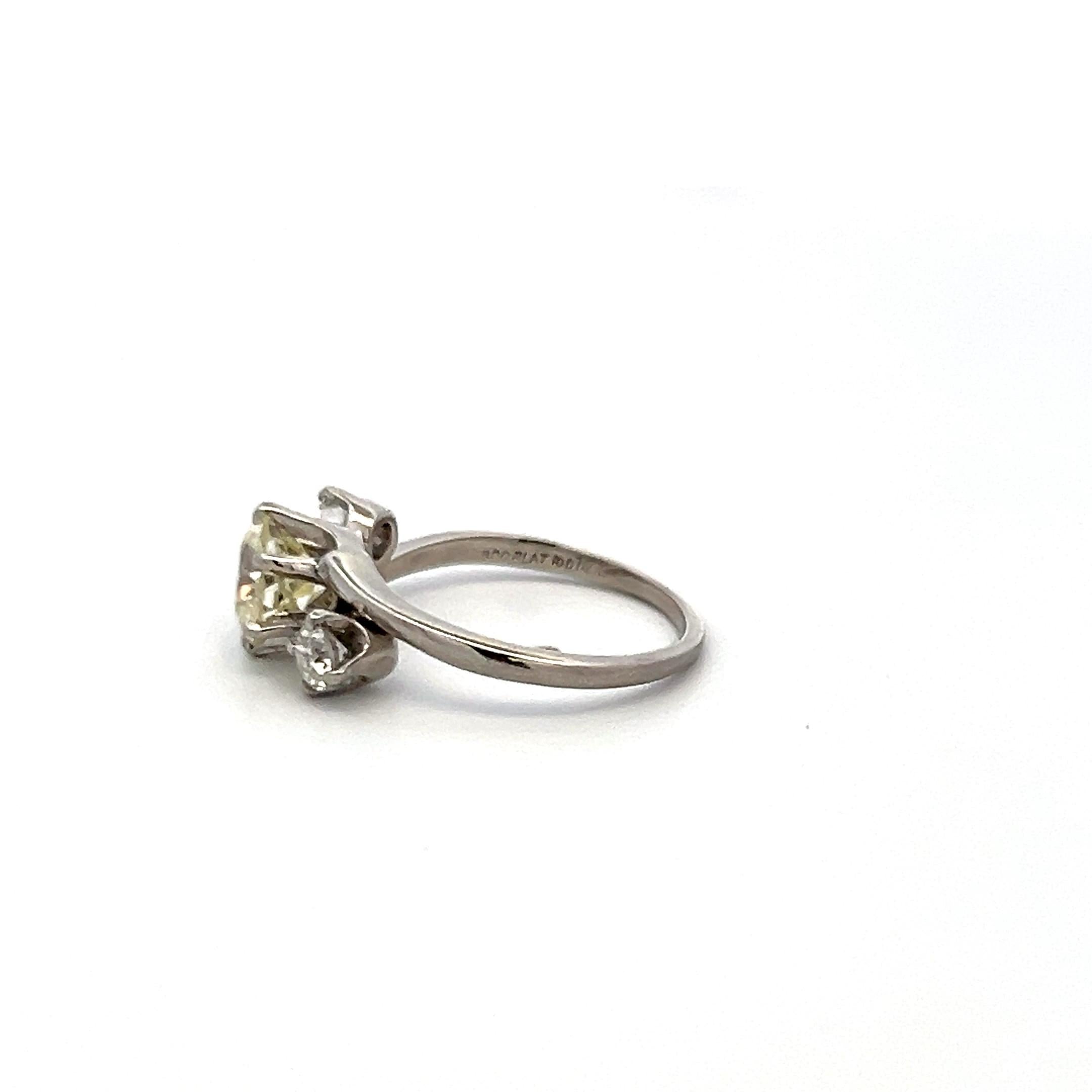 Vintage Three-Stone Platinum Ring with 1.30 Carat Old European cut GIA Diamond