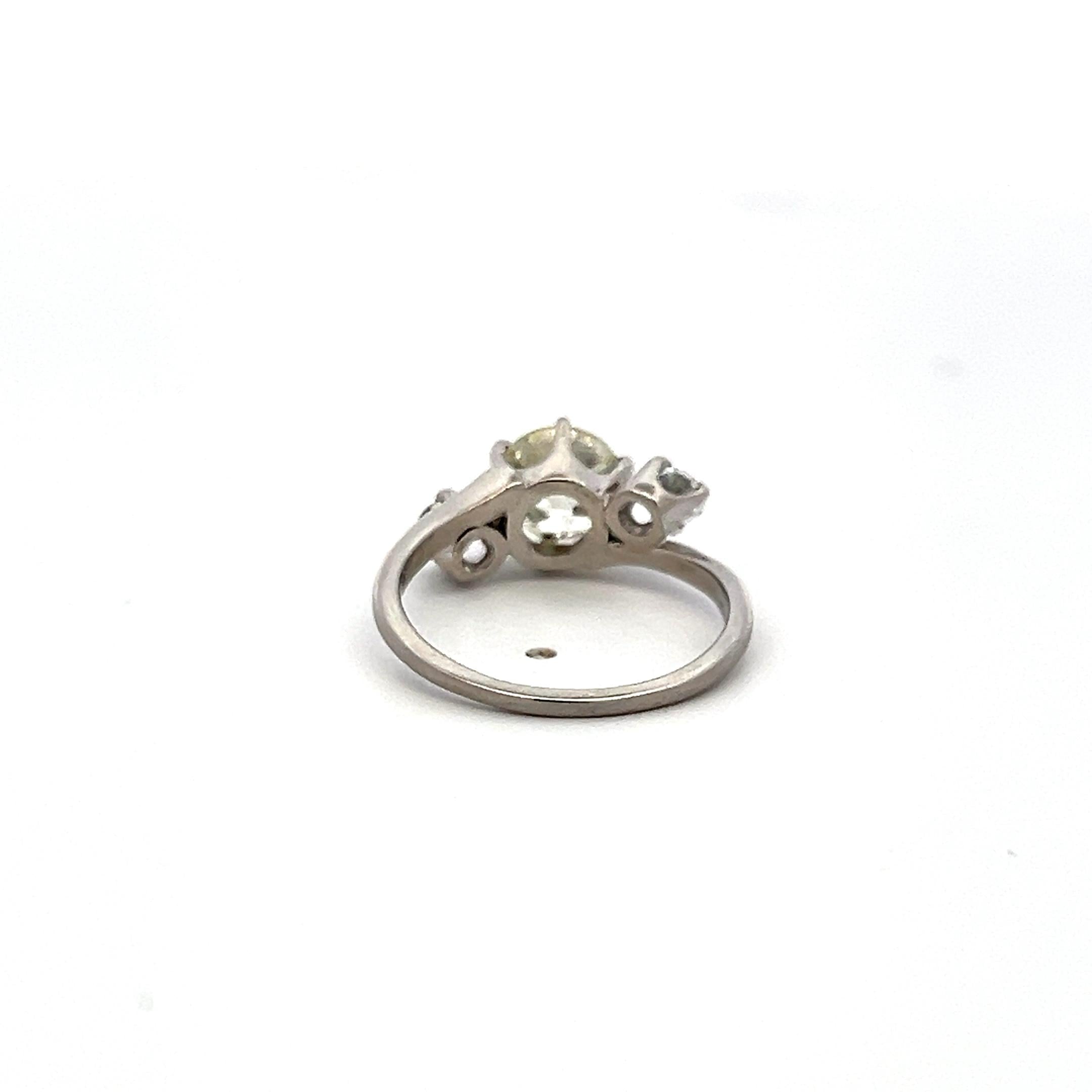 Vintage Three-Stone Platinum Ring with 1.30 Carat Old European cut GIA Diamond