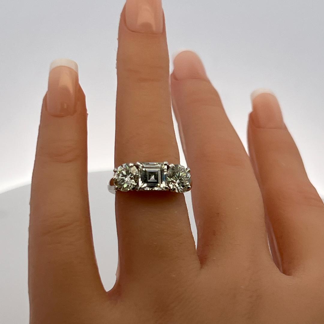 Vintage 4.02 Carat Asscher and Round GIA Diamonds Platinum Three-Stone Ring