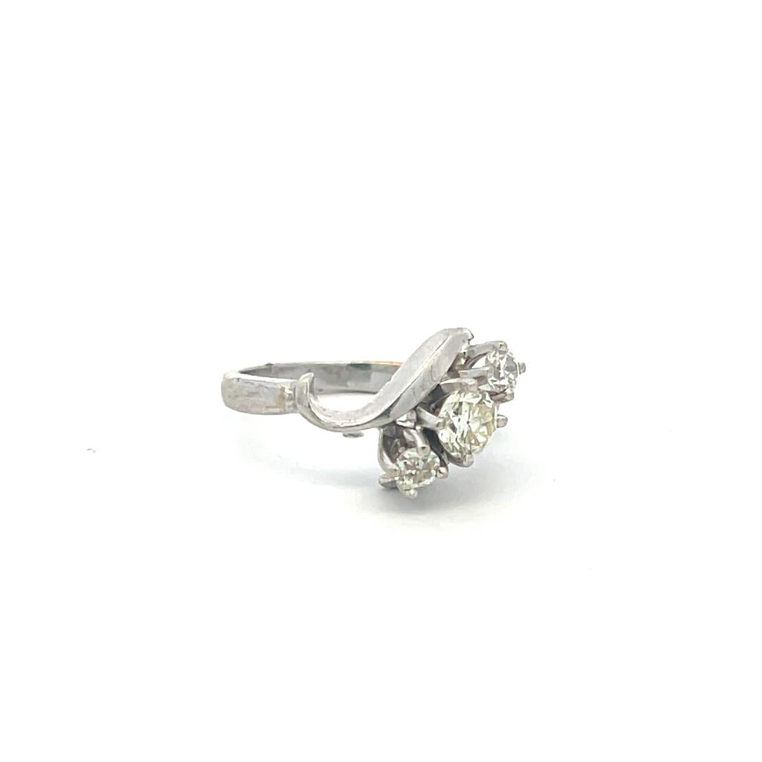 0.60 Carat Round Brilliant K-I VS Diamond 14 Karat White Gold Three-Stone Ring