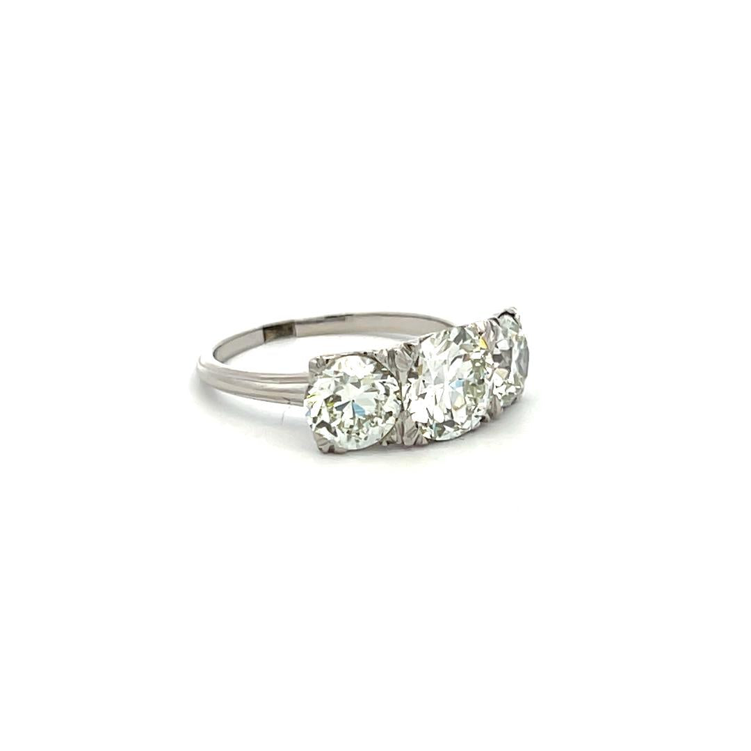 3.34 Carat Circular Brilliant Cut K-J SI1-VVS2 Diamond Platinum Three-Stone Ring