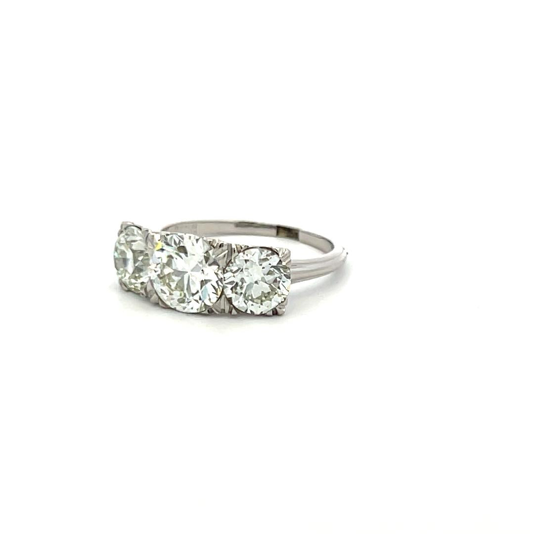 3.34 Carat Circular Brilliant Cut K-J SI1-VVS2 Diamond Platinum Three-Stone Ring