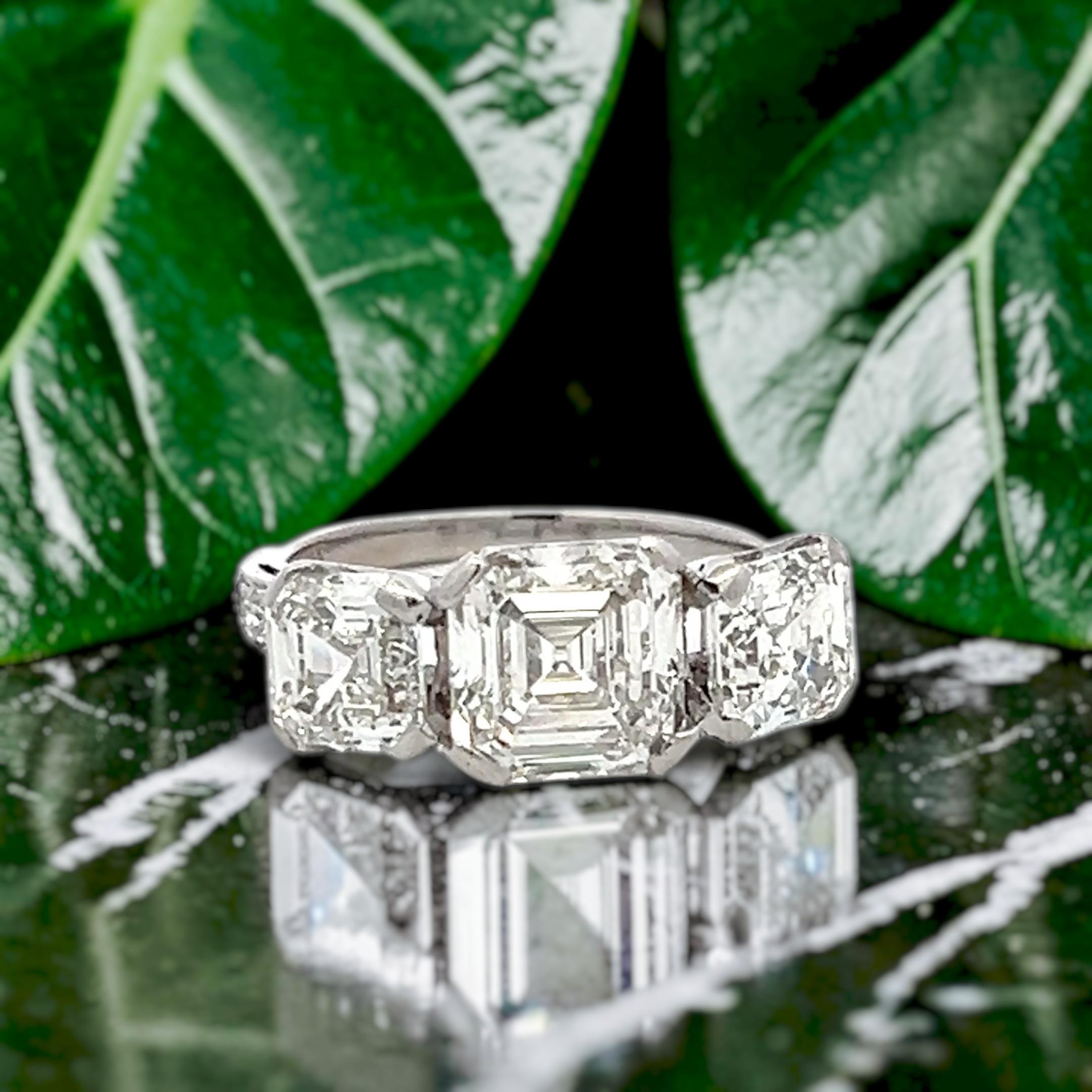 Vintage White Platinum Three-Stone Ring with 3.92 Carat Asscher Cut Diamonds GIA
