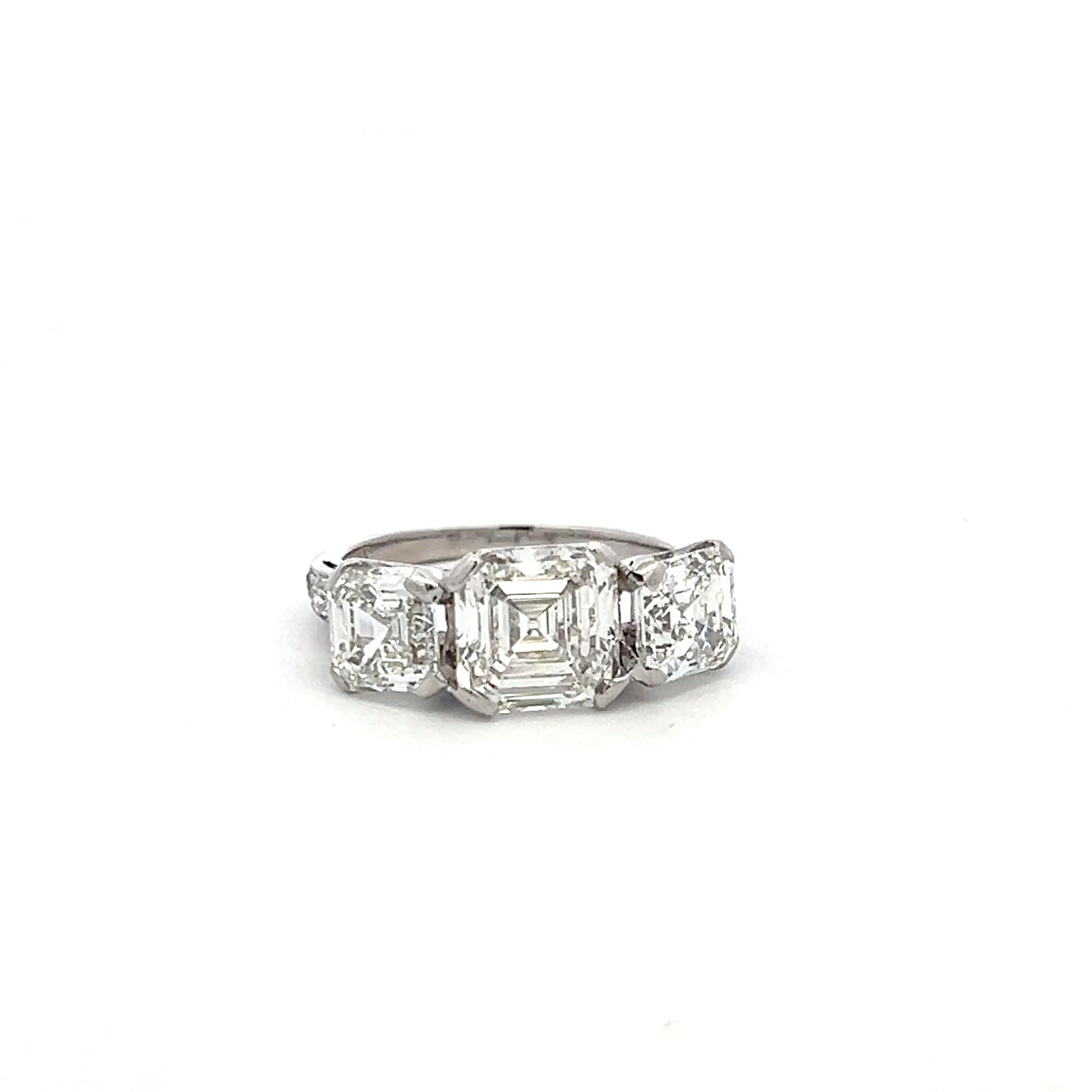 Vintage White Platinum Three-Stone Ring with 3.92 Carat Asscher Cut Diamonds GIA