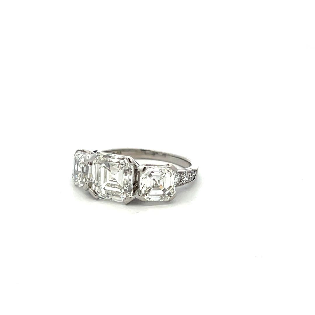 Vintage White Platinum Three-Stone Ring with 3.92 Carat Asscher Cut Diamonds GIA