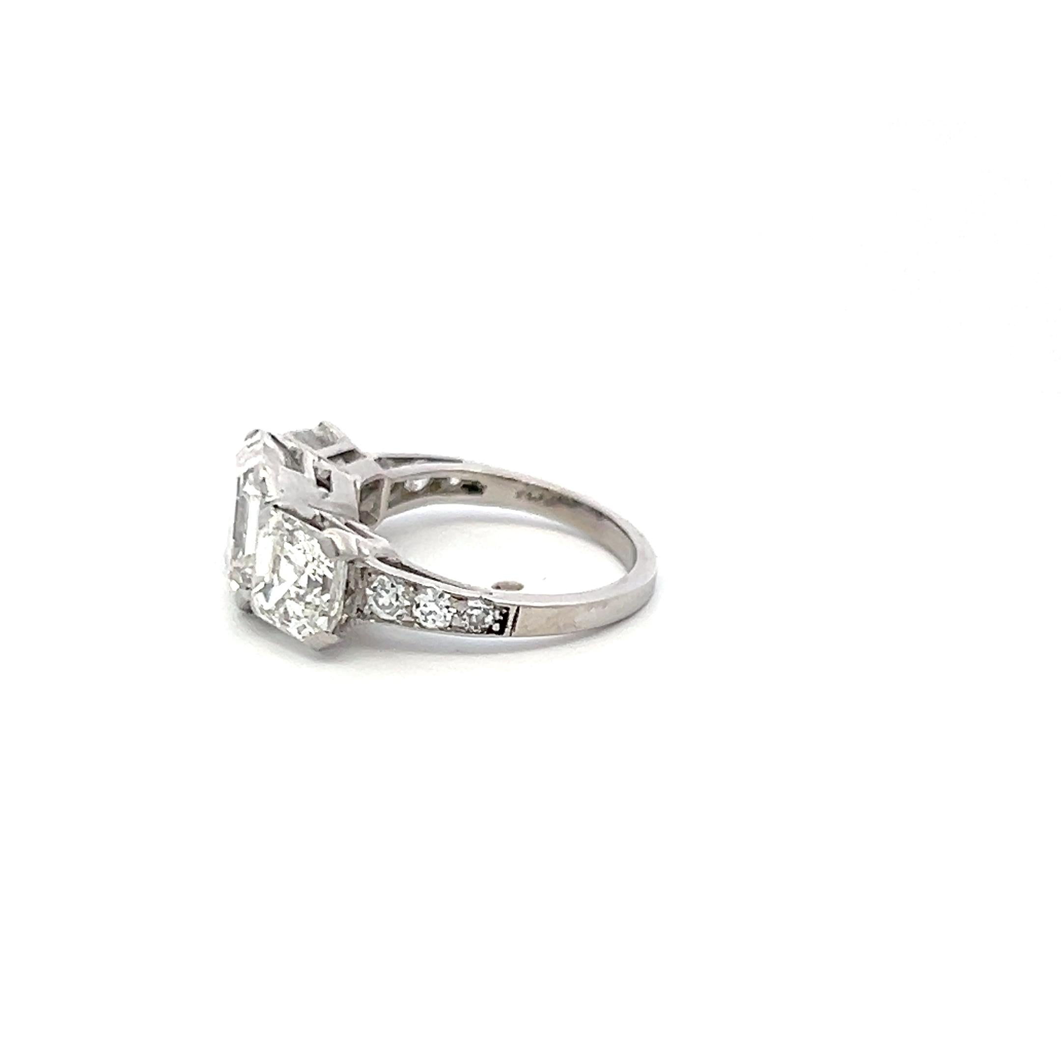 Vintage White Platinum Three-Stone Ring with 3.92 Carat Asscher Cut Diamonds GIA