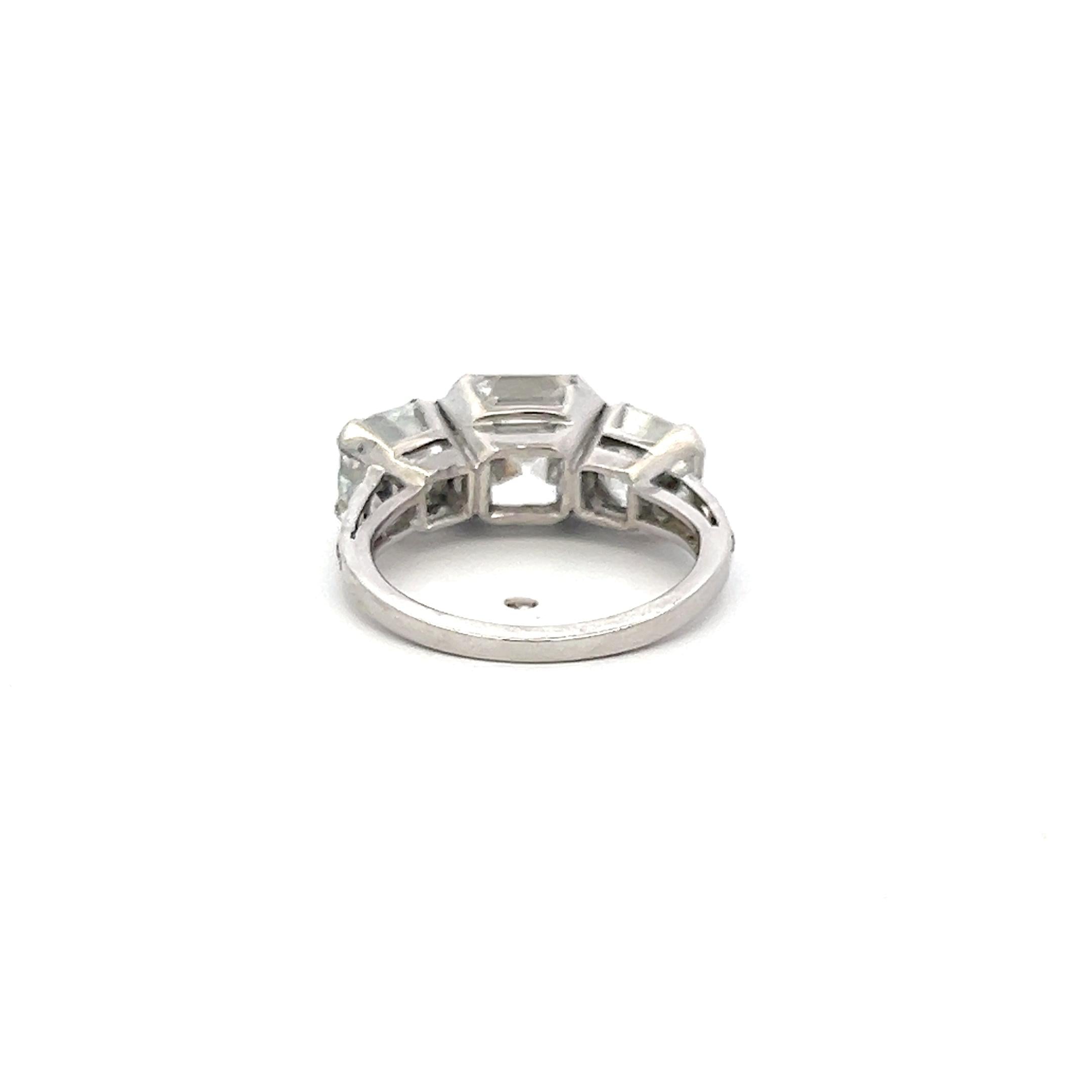 Vintage White Platinum Three-Stone Ring with 3.92 Carat Asscher Cut Diamonds GIA