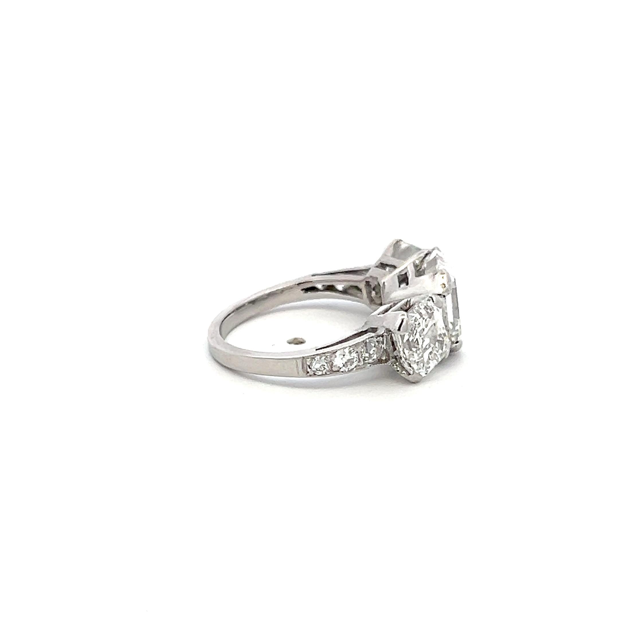 Vintage White Platinum Three-Stone Ring with 3.92 Carat Asscher Cut Diamonds GIA