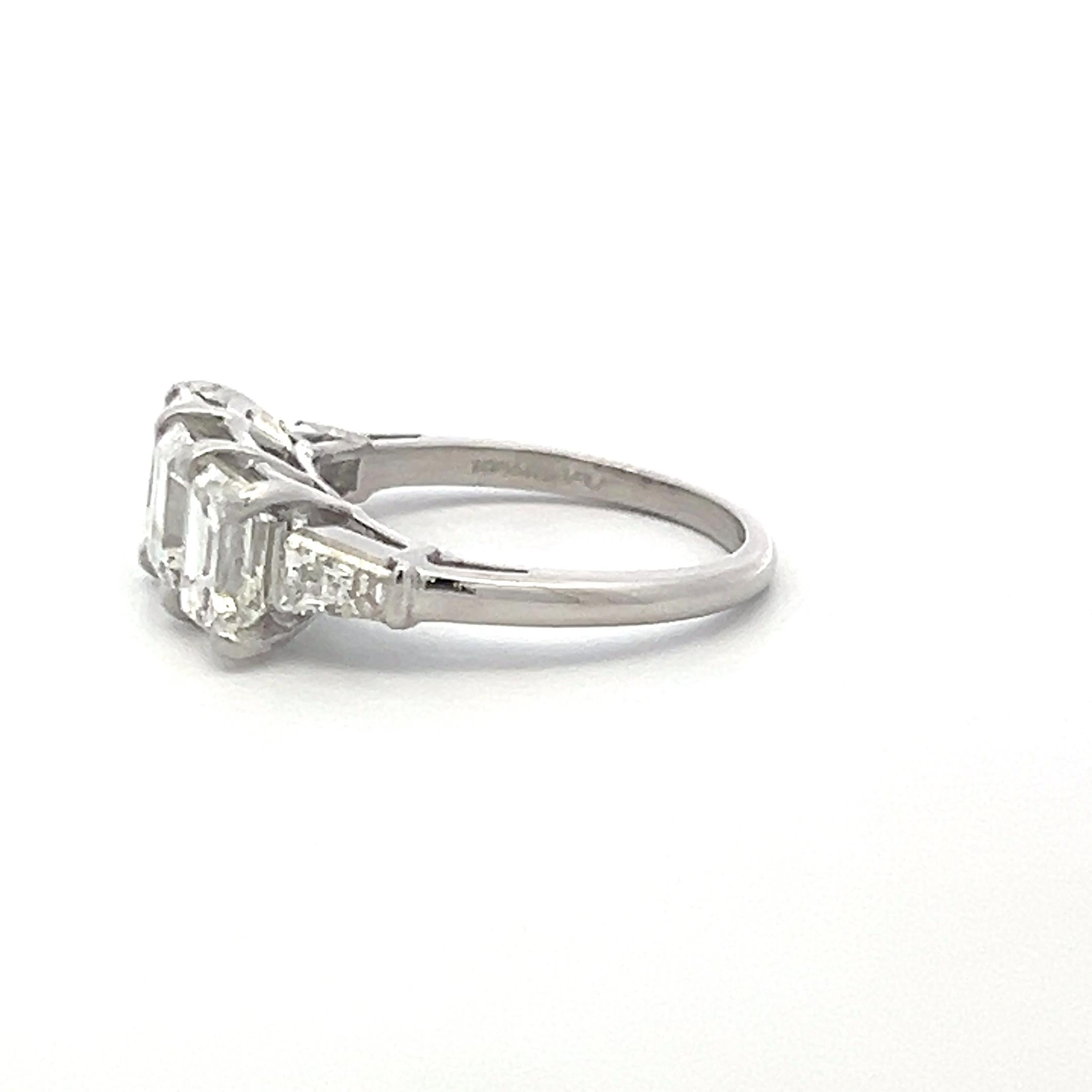 Vintage White Platinum Three-Stone Ring with 2.91 Carat Emerald Cut Diamonds GIA
