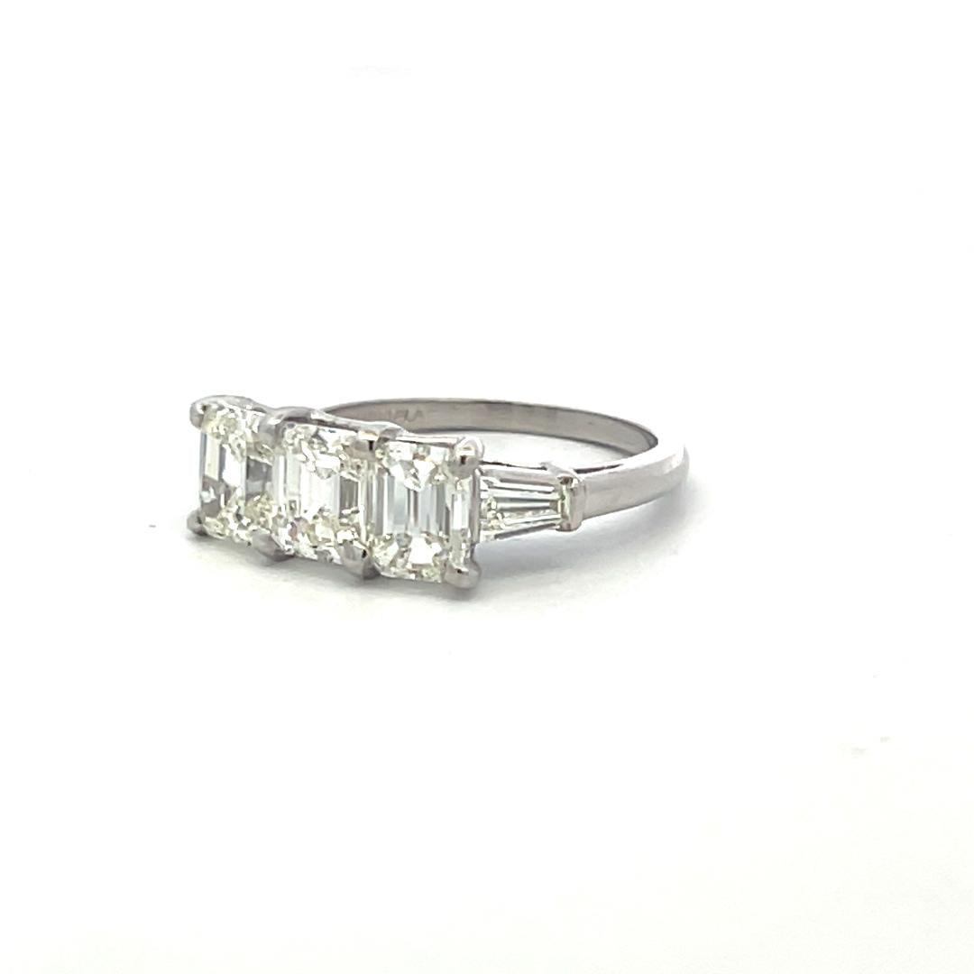 Vintage White Platinum Three-Stone Ring with 2.91 Carat Emerald Cut Diamonds GIA
