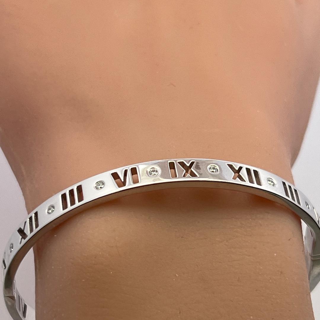 Tiffany & Co 18K White Gold Bangle Bracelet with 0.15 Carat Round F VS Diamonds