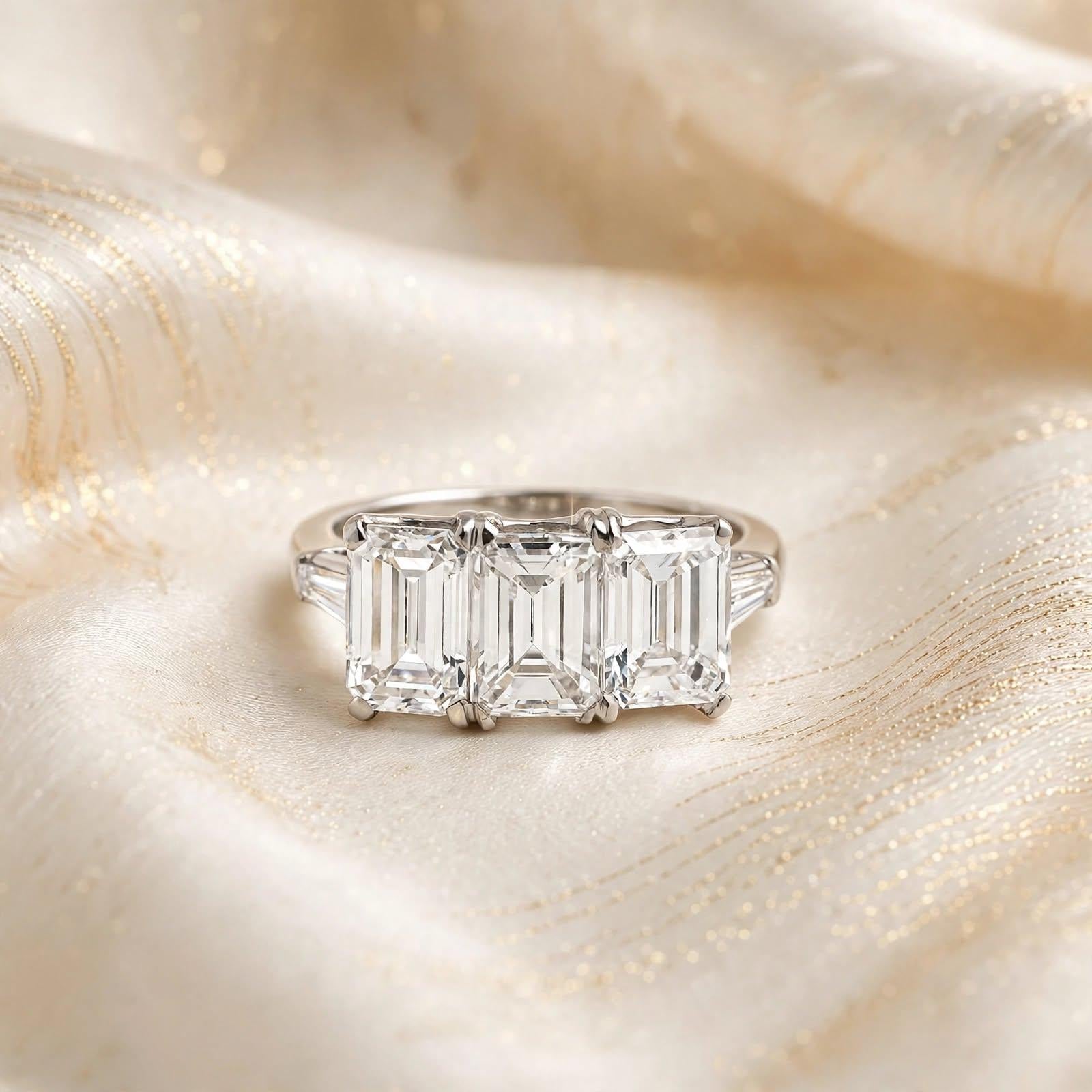 Platinum Three-Stone Ring with 3.27 Carat Emerald Cut Diamonds Size 4.5 GIA