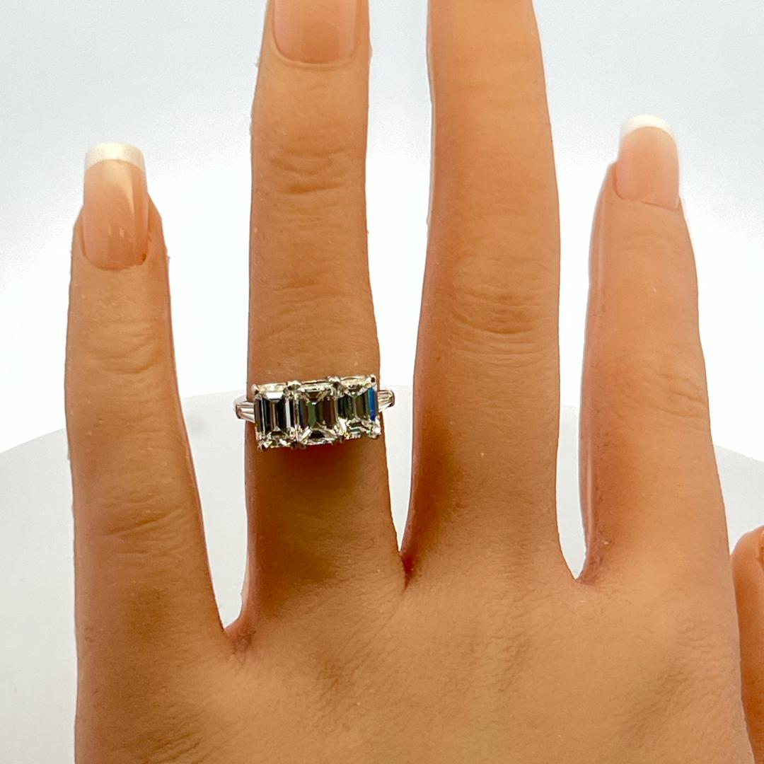 Platinum Three-Stone Ring with 3.27 Carat Emerald Cut Diamonds Size 4.5 GIA