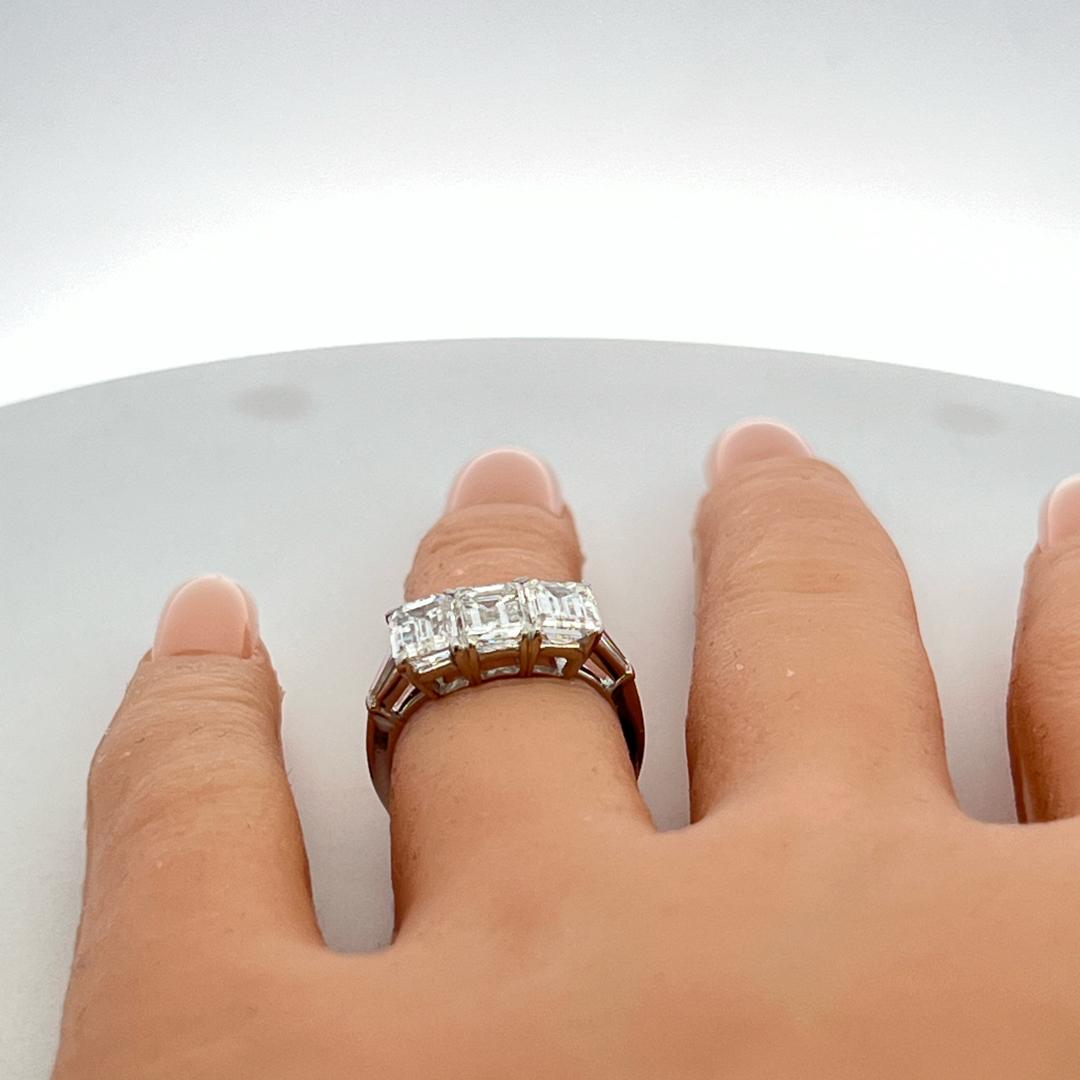 Platinum Three-Stone Ring with 3.27 Carat Emerald Cut Diamonds Size 4.5 GIA