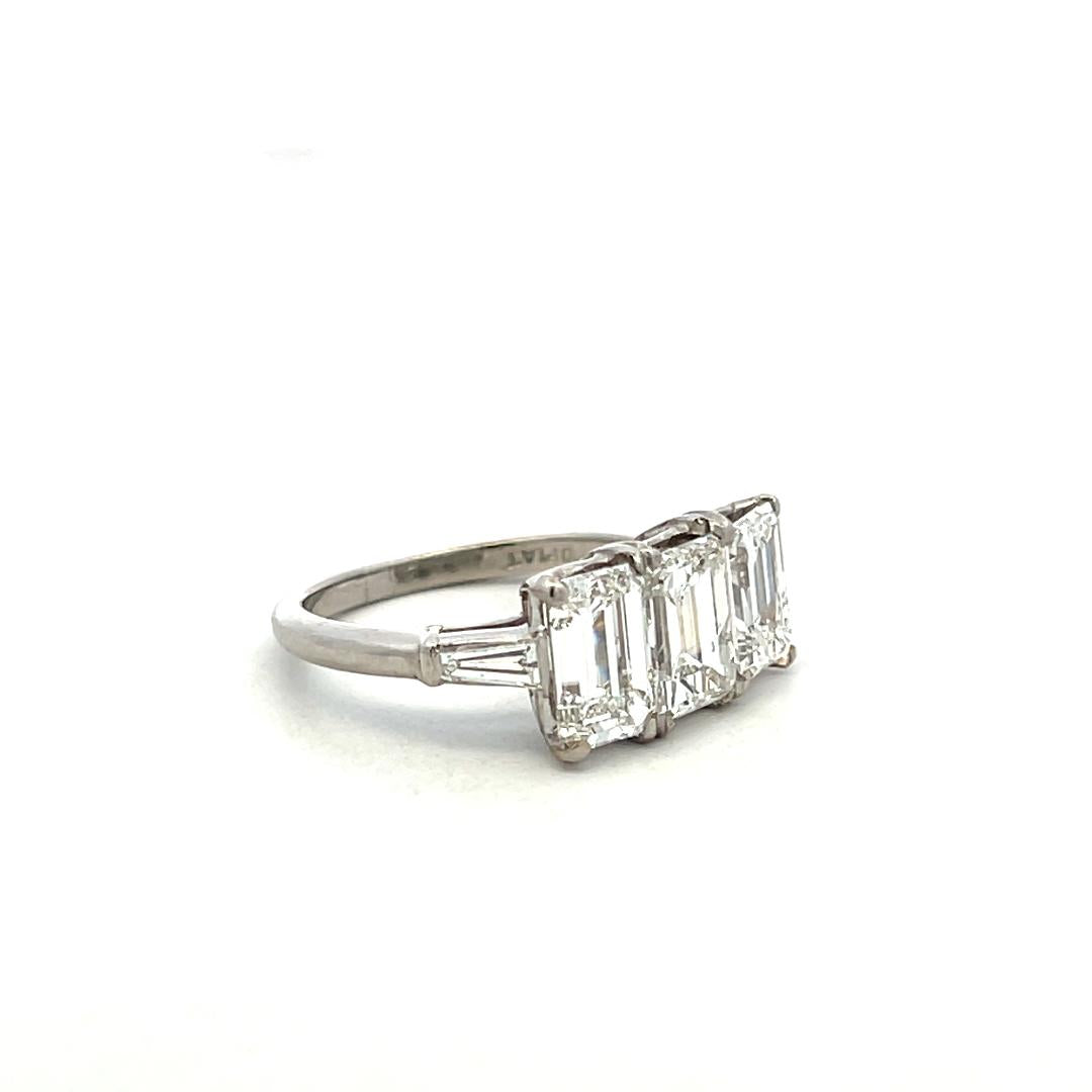 Platinum Three-Stone Ring with 3.27 Carat Emerald Cut Diamonds Size 4.5 GIA