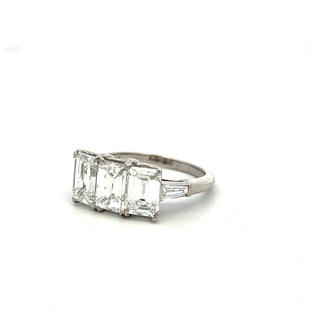 Platinum Three-Stone Ring with 3.27 Carat Emerald Cut Diamonds Size 4.5 GIA