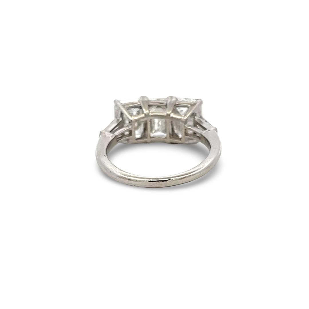 Platinum Three-Stone Ring with 3.27 Carat Emerald Cut Diamonds Size 4.5 GIA